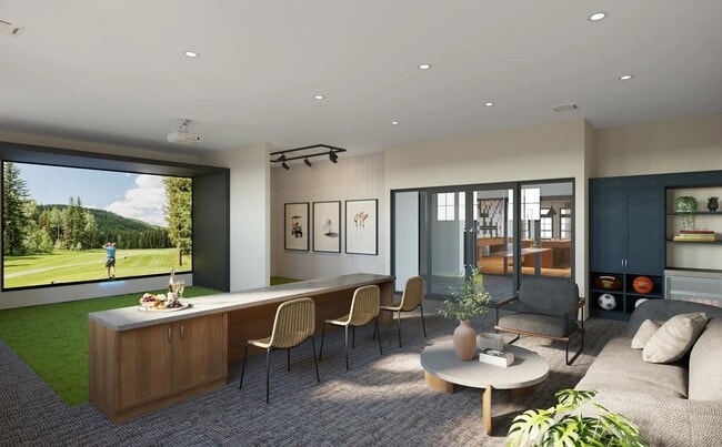 Practice your swing or perfect your shot in the multi-sport simulator lounge at Modera South Shore apartments. - Modera South Shore