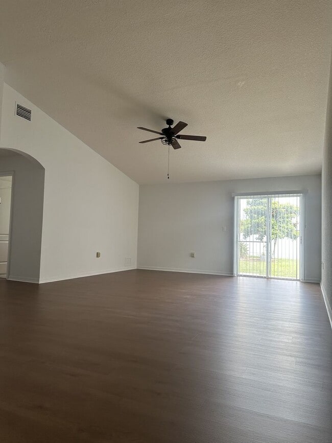 Photo - Spacious 4 bed 2 bath, 2 car garage with fenced-in backyard in Poinciana Neighborhood