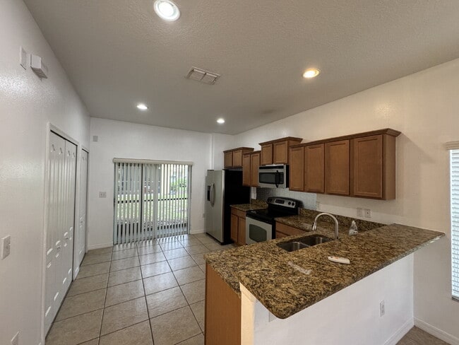 Photo - "Charming Tampa Retreat: Stylish 2-Bedroom with Granite Finishes & Guest Suite!"