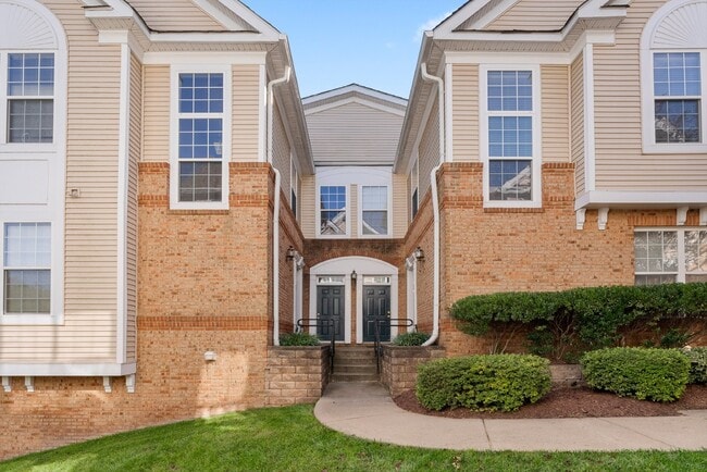 Building Photo - Experience luxurious living in this two-bedroom, two-bath condo located in the Ridges at Belmont ... Unit #103