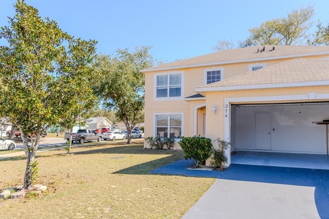 Photo - Spacious 4-Bed Groveland Home with Attached Garage, Central Air, and Private Patio