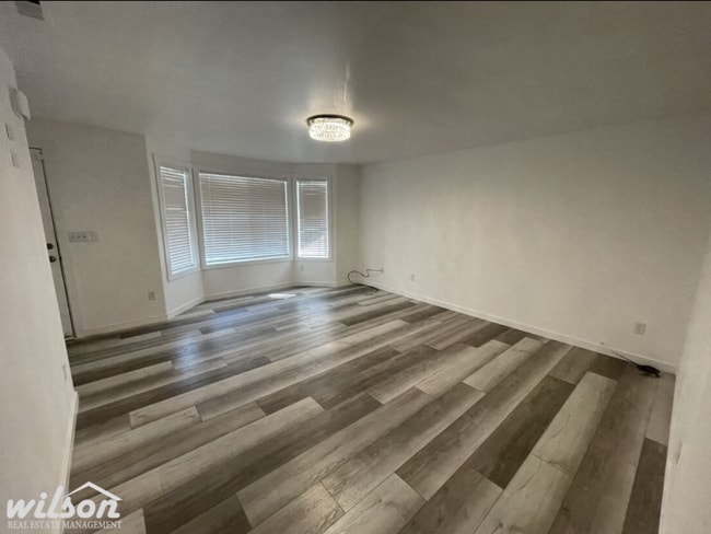 Photo - 3 Bed, 2 Bath Home with a Two-Car Garage, Fenced Backyard, and Lawn Care Included