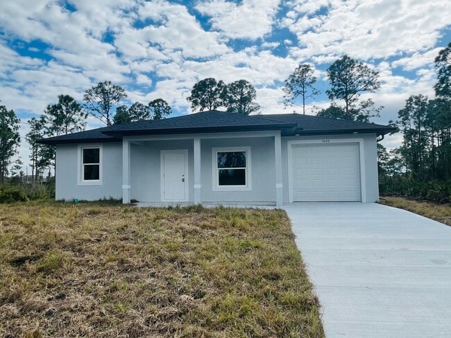 Building Photo - BRAND NEW ONE BEDROOM, ONE BATH-ONE CAR GARAGE- LEHIGH ACRES