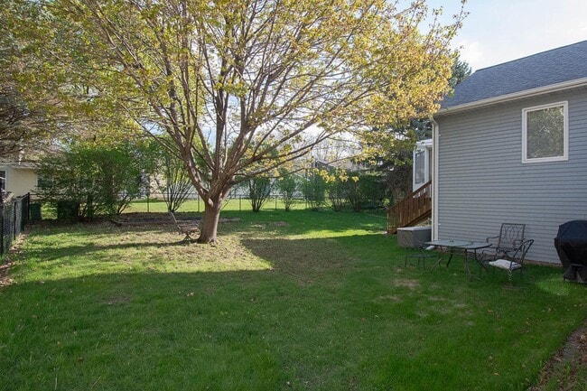 Photo - 3-Bedroom NE Rochester home with Sunroom, Fenced Backyard & Attached Garage