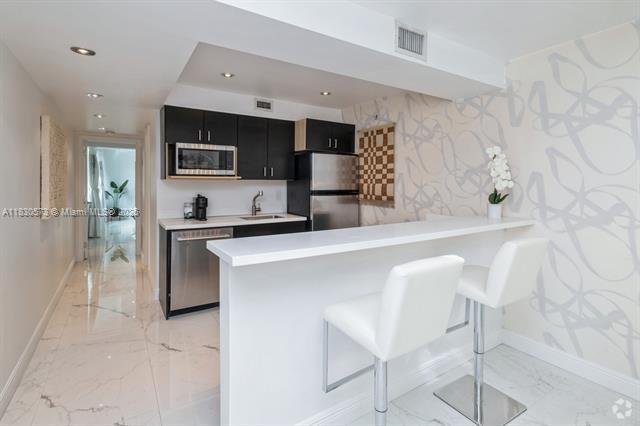 Building Photo - 405 N Hibiscus Dr Unit 101 Rental