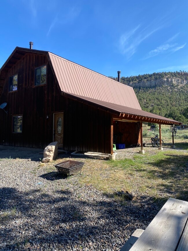 Back exterior with covered storage/parking - 934 Catamount Dr