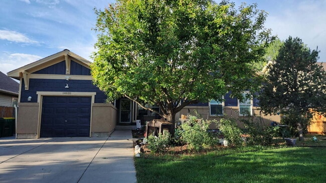 Building Photo - Spacious 5-Bed Retreat with Modern Updates in Aurora. Included - Greenhouse and Shed!