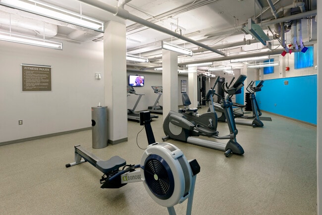Fitness center with cardio equipment and flat screen televisions