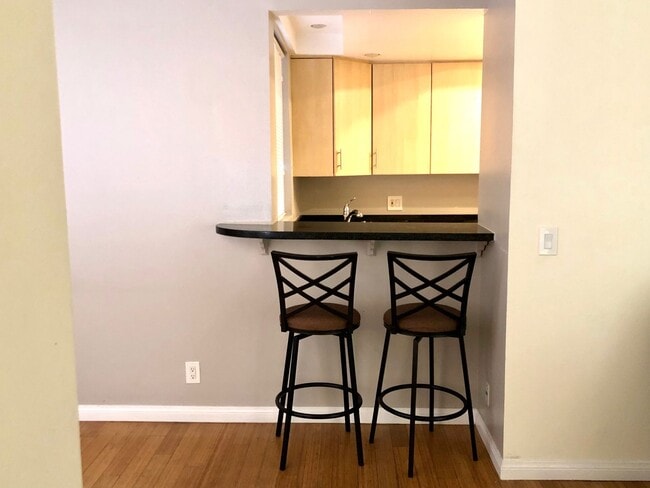 Photo - REMODELED CONDO WITH WOOD FLOORS! NEW KITCHEN! FIREPLACE! GYM, POOL! REC ROOM AND MORE