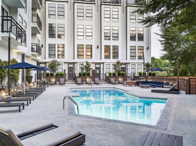 Resort-style swimming pool with sundeck.