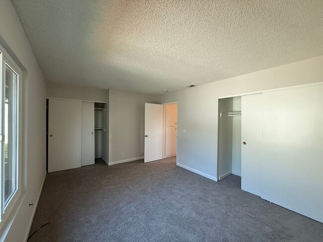 Photo - Quiet unit with new paint, new carpet, new windows and Air Conditioning!
