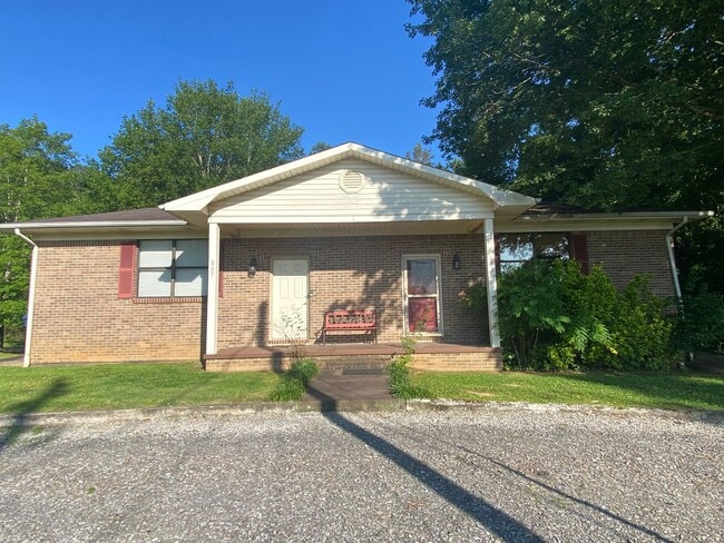 Building Photo - 2 Bedroom 1 Bath Duplex with garage/basement, side porch, and carport.