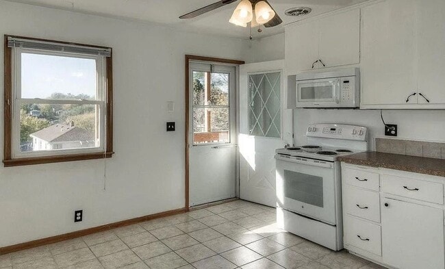 Photo - Bright & Spacious 3-Bedroom Duplex Unit on Large Corner Lot with Wood Floors & Garage!