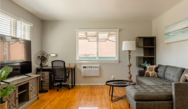 Living Room, Sony 65 in smart TV - 191 E Fillmore St Apartments