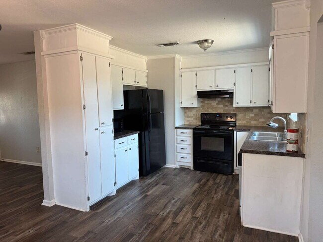 Updated 3 bedroom one bath home with a shade tree and large yard.
