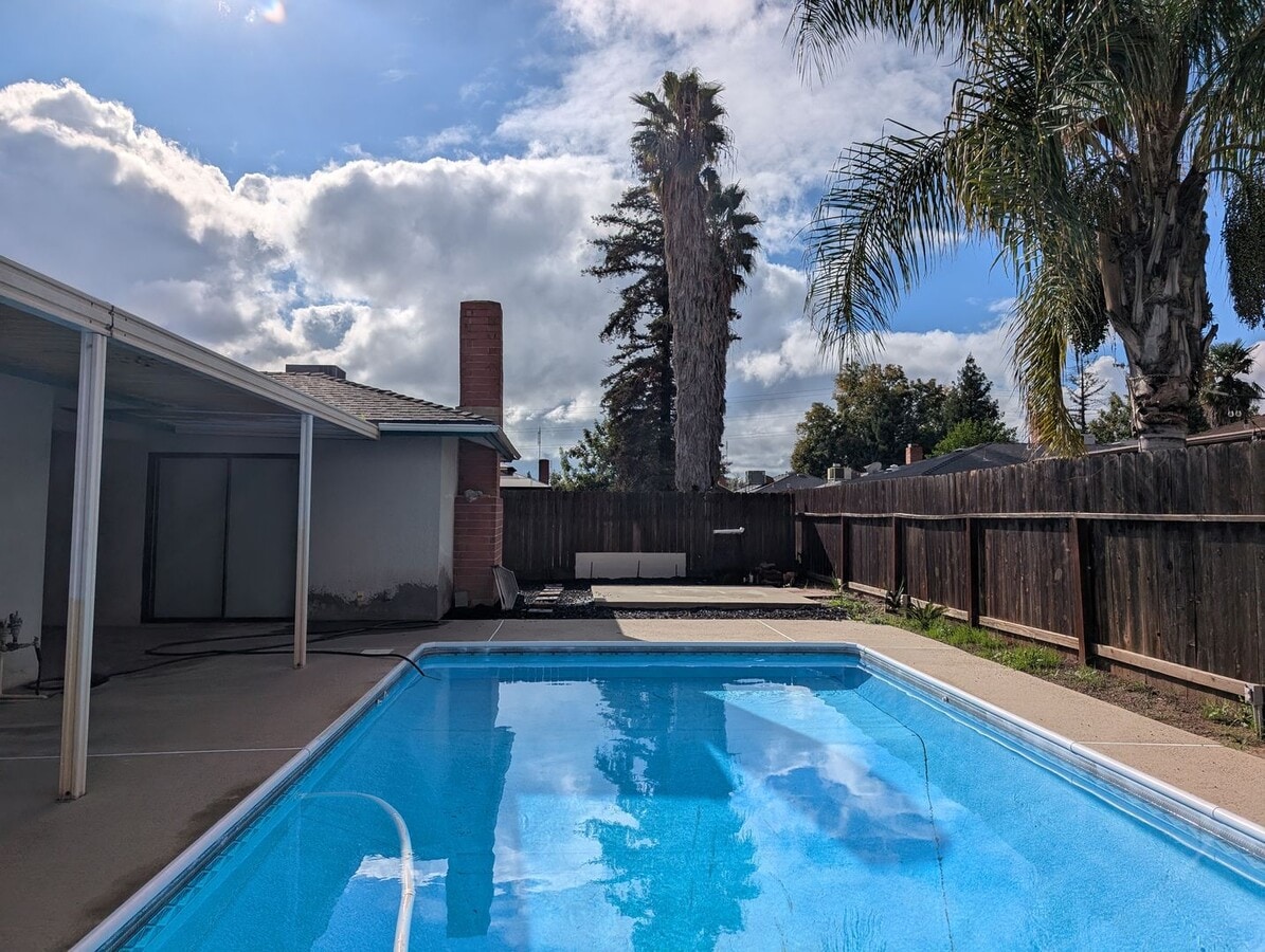 Photo - Nice home home offering nice amenities. Swimming pool + close to shopping and schools.