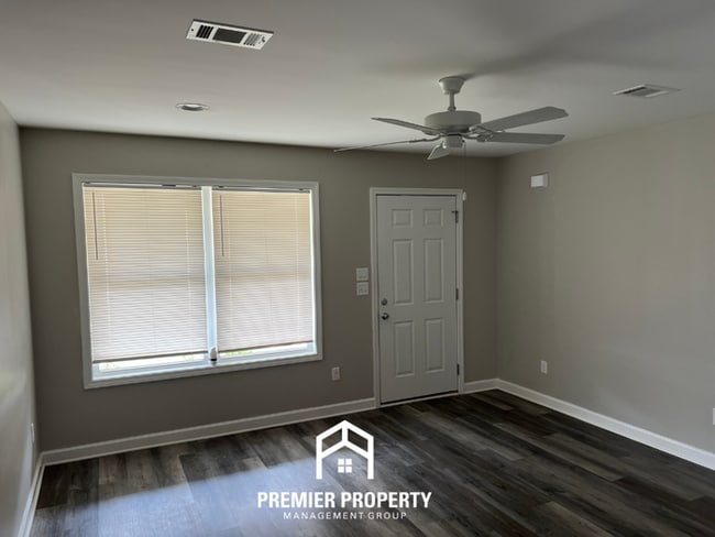Photo - Spacious 4BR/2BA in Tuscaloosa | Hardwood Floors, 2-Car Garage & Covered Back Patio