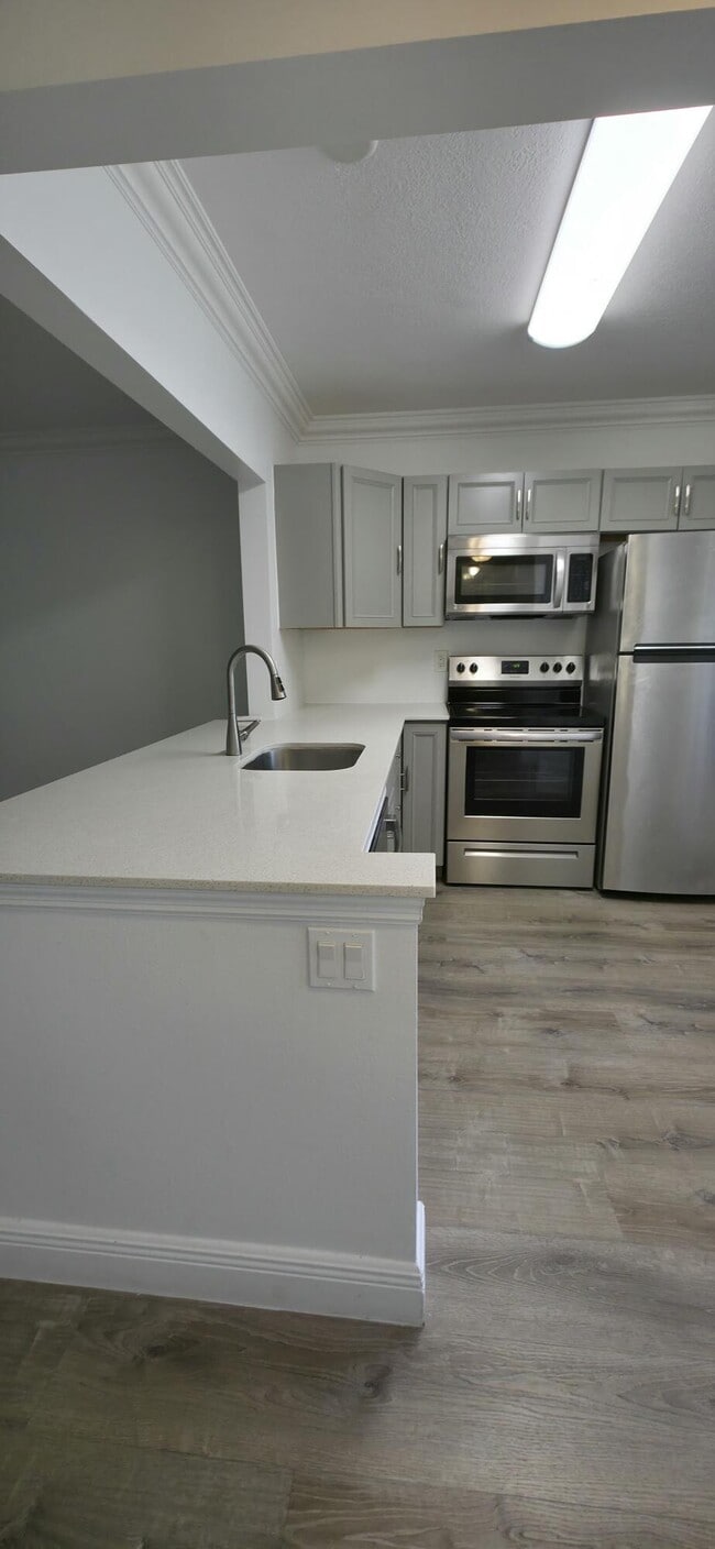 Building Photo - 6091 NW 61st Ave Unit 105