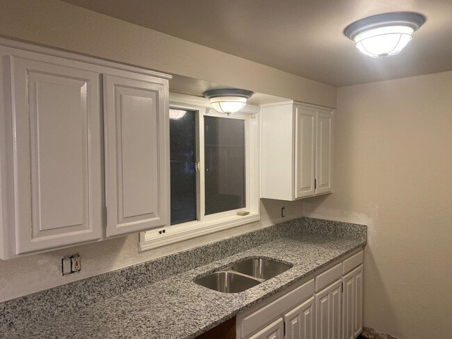 Photo - 4 Bedroom, 2 Bathroom House with Large Fenced Backyard, New Vinyl Plank Flooring, Granite Counter...