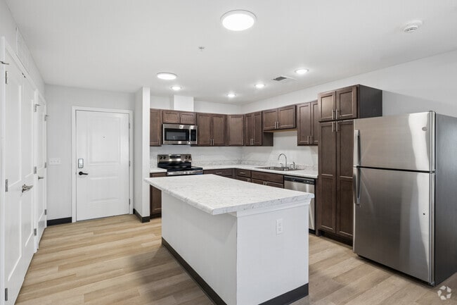 3BR, 2BA - 1,097SF - Kitchen and Dining Area