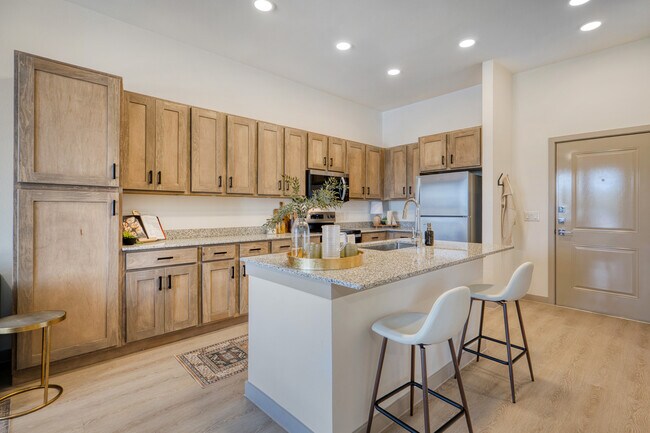 Stylish kitchen with modern finishes and ample storage at Residence at Pearsall Park
