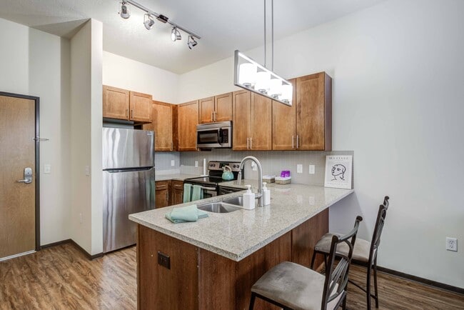 The-Knoll-Dinkytown-Off-Campus-Apartments-Near-The-University-of-Minnesota-Kitchen-with-Extra-Wide-Kitchen-Islands-Bar-Stool-Seating-Granite-Countertops