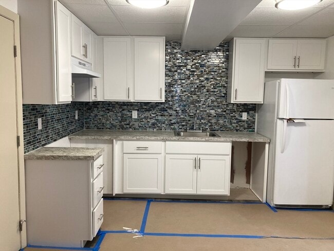 Building Photo - 32 W Main St Unit 202