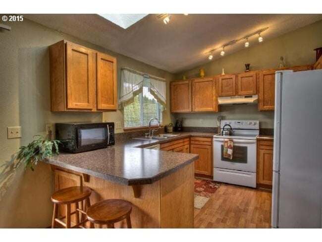 Photo - 3 Bedroom Home with Vaulted Living Room Near The Streets of Tanasbourne with Garage & Yard