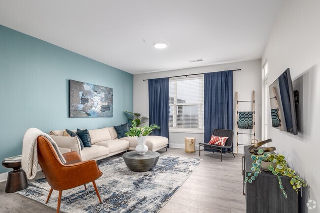 A - 1BR, 1BA - 859SF - Living Room - McDowell Point 55+ Active Adult Apartment ...