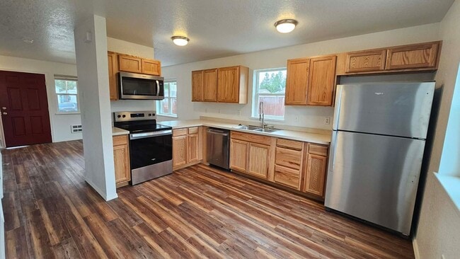 Photo - House with fenced yard and garage