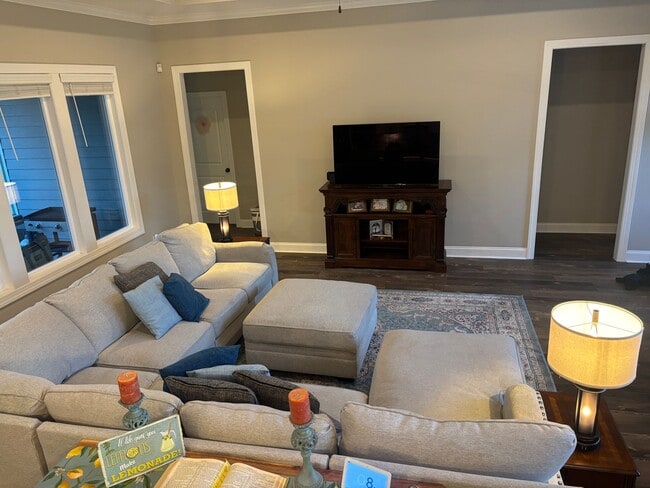 Photo - Spacious 4BR/3BA Creekside West Home with Screened Porch, Fenced Yard & 3-Car Garage