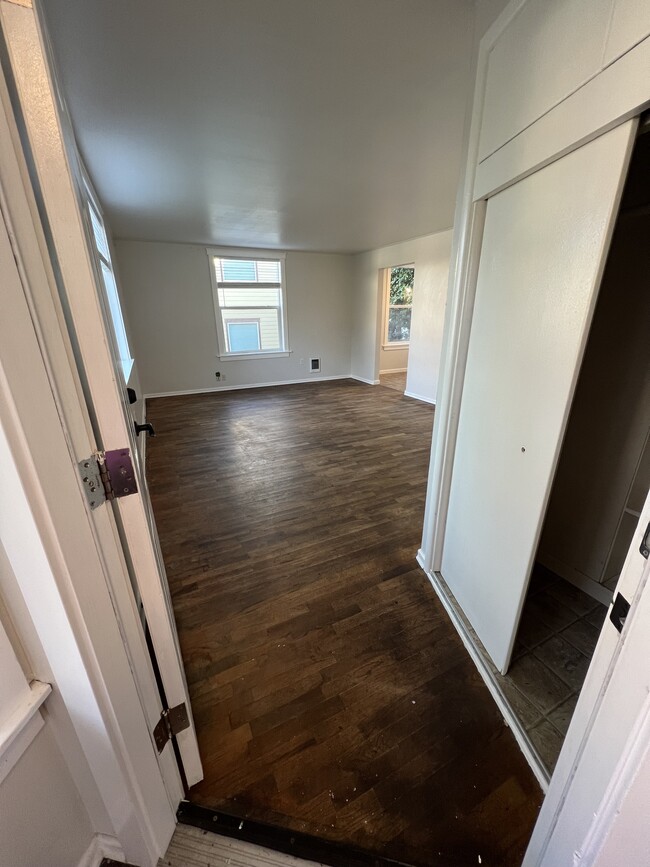 View of entry way closet & living room. - 620 6th Ave Unit 1