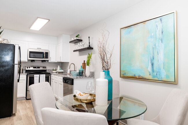 Dining area with hardwood-style flooring