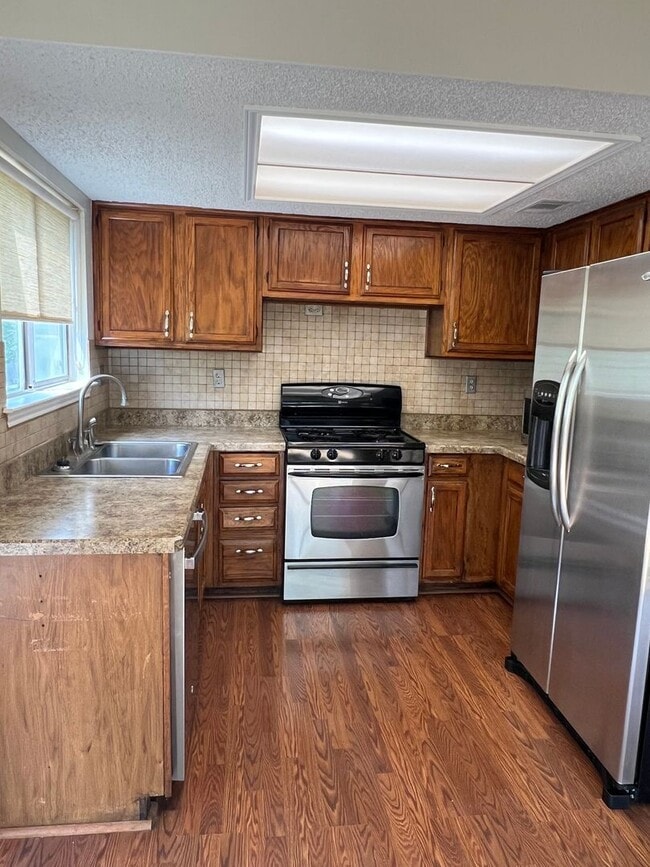 Photo - Corner Lot with Large Deck and Cozy Backyard