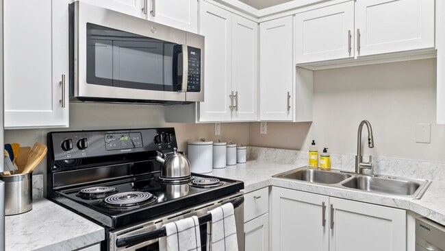 This brilliantly upgraded kitchen will serenade your senses. Capture the luminous allure as it dances off the white cabinets and glistening stainless-steel appliances.