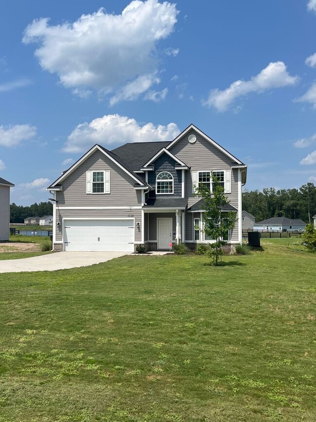 Building Photo - Spacious 4-Bedroom Pet Friendly Home with a Serene View - Available for Rent!
