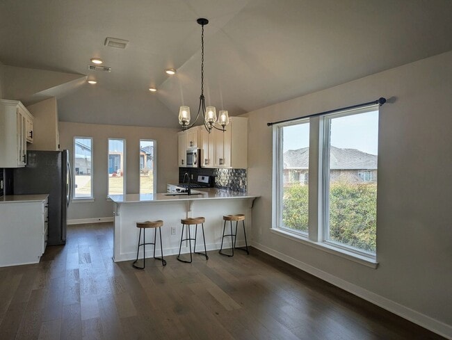 Photo - Spacious Yukon Home with Storm Shelter, 2-Car Garage & Fenced Yard!