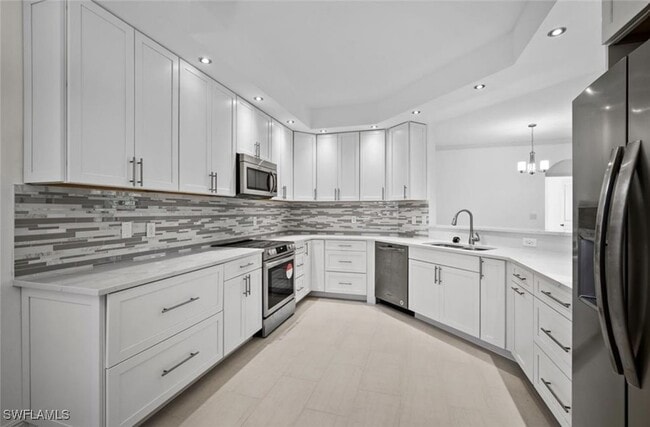Building Photo - 7056 Pelican Bay Blvd Unit B102 Rental