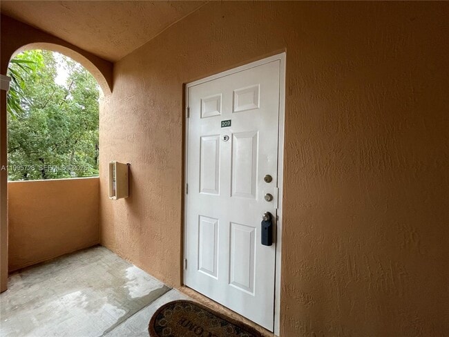 Building Photo - 7080 NW 177th St Unit 209-13