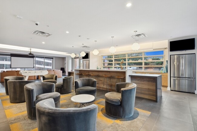 Clubroom with bar, theater, and gaming area
