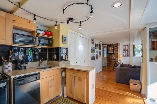 Kitchen flows into LR. Large closet. - 2 Emmons Pl Condo Unit 2A