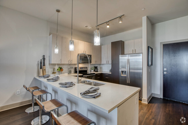 Chef-inspired kitchens feature stainless steel appliances - Centric LoHi by Windsor Rental