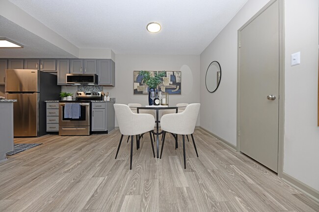 Dining Room + Hardwood Style Flooring - Preston Apartment Homes