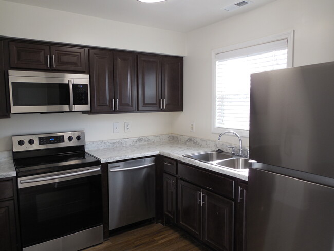 Spacious kitchen featuring stainless steel appliances - 1163 Fords Pointe Cir Townhome