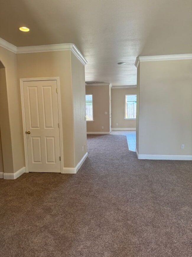 Photo - Enterprise Neighborhood 3 Bedroom Home with bonus room and 3 car garage- Landscaping Included!