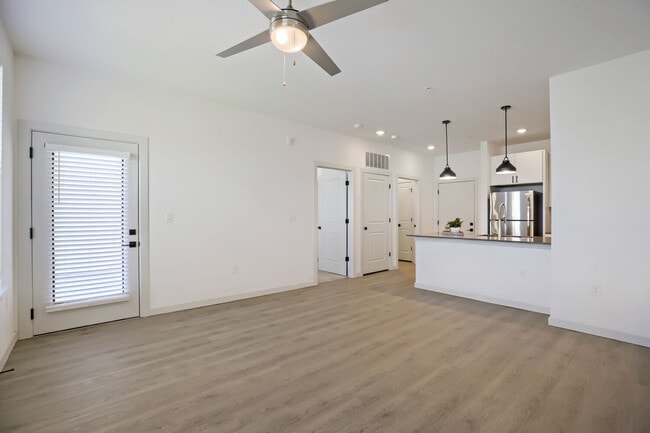 The BH-A1 (L) floor plan's open-concept layout connects your living area seamlessly to the kitchen. Garrett Harvest Junction West, Longmont, CO. - Garrett Harvest Junction West