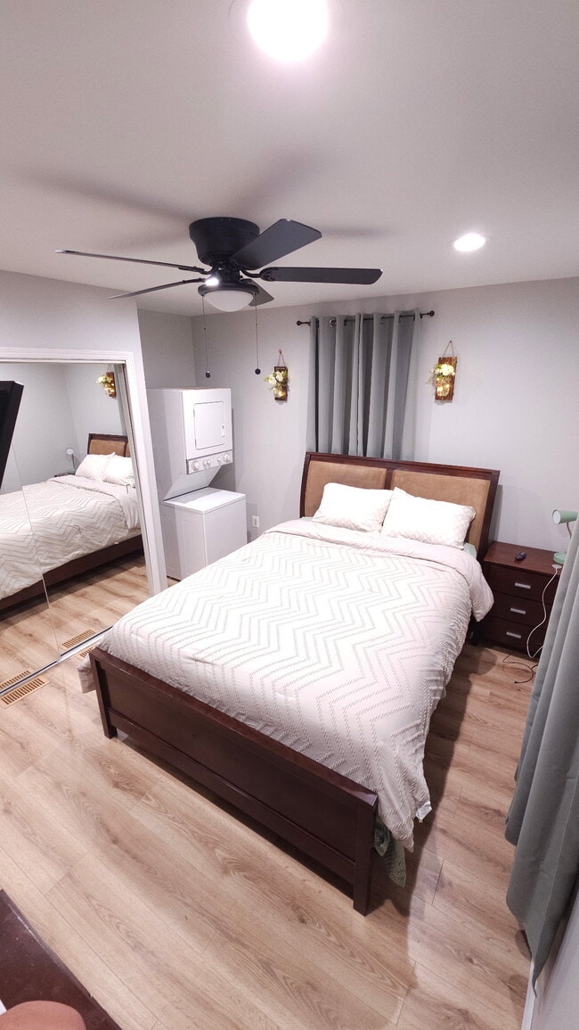 Spacious bedroom with queen sized bed and large closet/washer and dryer
