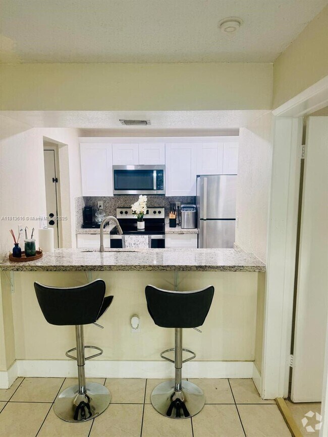 Building Photo - 7035 NW 186th St Unit D108 Rental