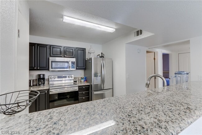 Building Photo - 5055 W Hacienda Ave Unit 2124