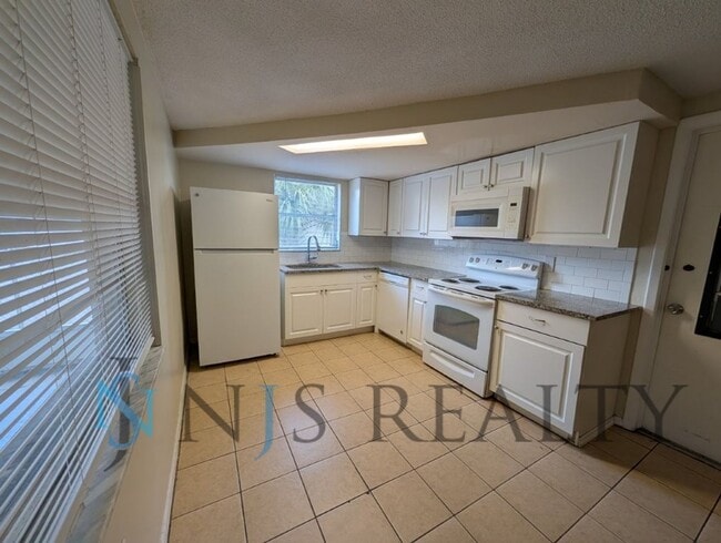 Photo - True 3 Bed~2 Bath~with garage. Over 1,000 sq ft, with updated kitchen & bathrooms, large open liv...